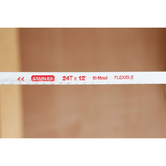 STANLEY 1-20-110 flexible bi-metal hacksaw blade, 24T x 12 inch, close-up view of blade edge and markings.