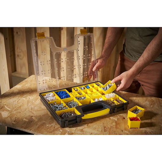 STANLEY 1-92-748 organizer with yellow compartments, open lid, assorted hardware, angled view.