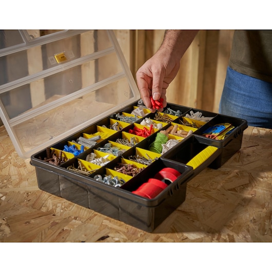 STANLEY 1-92-762 organizer box with yellow dividers, filled with assorted hardware, photo from above.