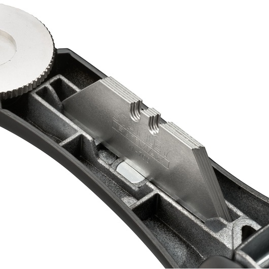 STANLEY FMHT10500-0 utility knife with exposed metal blade stack, close-up on storage compartment, white background.