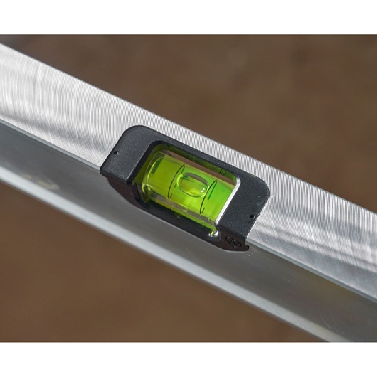 STANLEY FMHT43676-1 photography of aluminum spirit level with green vial, close-up angled view.