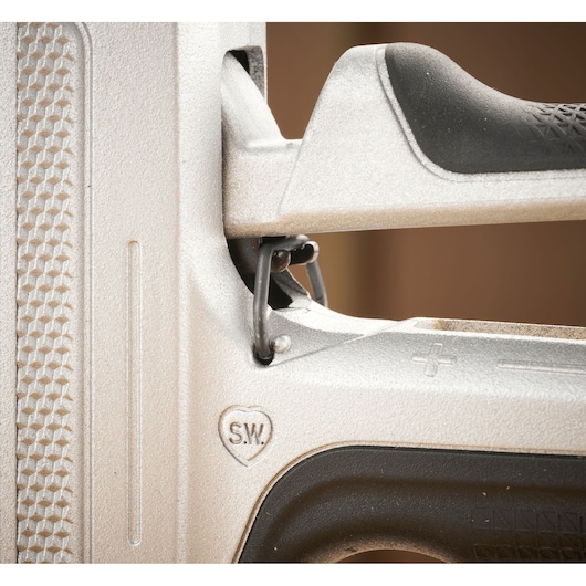STANLEY FMHT70100-0 stapler close-up showing textured grip, metal construction, and adjustment lever.