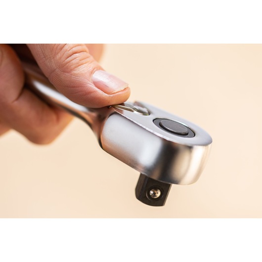 STANLEY FMMT82685-1 ratchet wrench close-up held by hand, showing metal finish and release button.