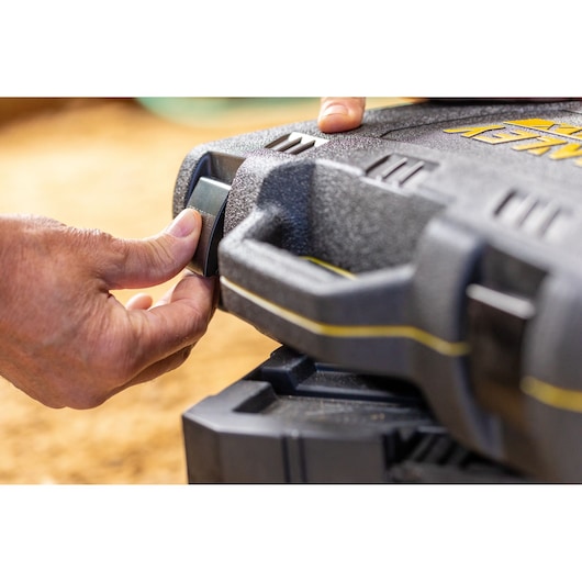STANLEY FMMT82826-1 toolbox handle and latch close-up, black textured surface with yellow accents.
