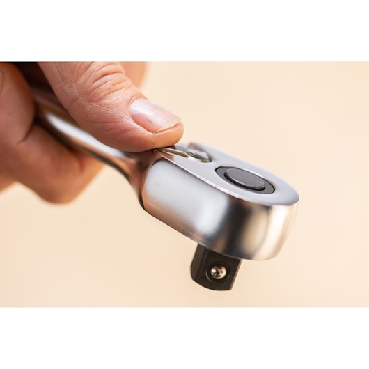 STANLEY FMMT82827-1 ratchet wrench close-up showing thumb on switch, hand tool category.