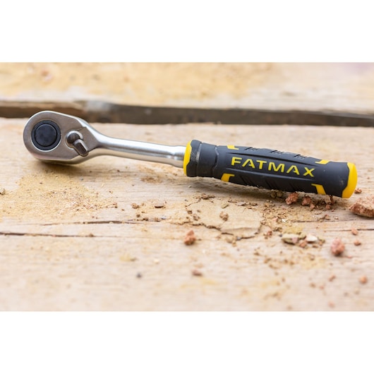 STANLEY FMMT82827-1 ratchet with black and yellow FATMAX handle, shown on wooden surface.