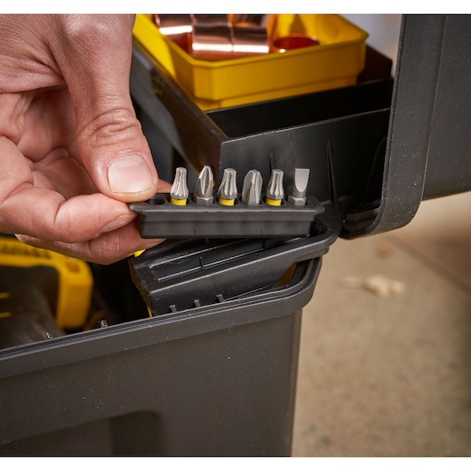 STANLEY FMST1-75792 storage box with yellow tray and screwdriver bits, close-up photography.