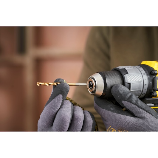 STANLEY SFMCD726B cordless drill photography, close-up view inserting drill bit.