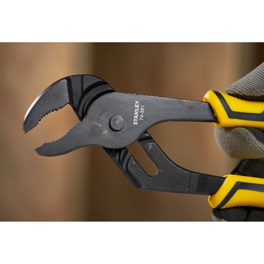 Stanley STHT0-74361 adjustable groove joint pliers with yellow and black handle, close-up view.