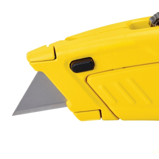 STANLEY STHT10430 utility knife close-up with yellow body and exposed sharp blade, side angle on white background.