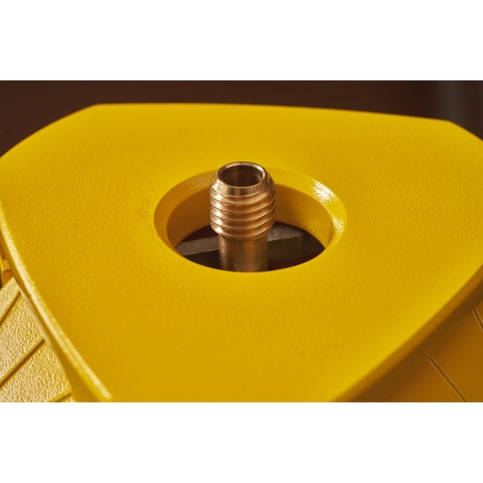 STANLEY STHT77625-1 photography of close-up yellow plastic housing with central threaded metal insert, top angle.
