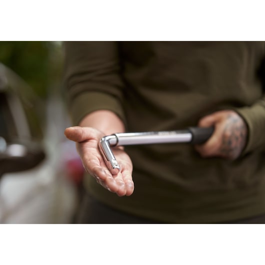 STANLEY STHT80890-0 socket wrench held in hand, shown outdoors, product detail photography.