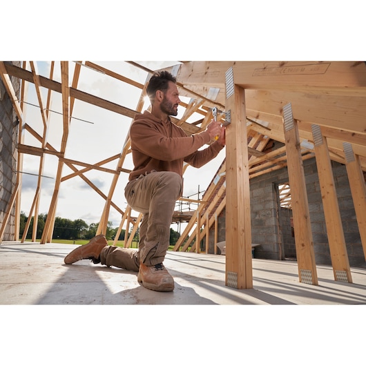 STANLEY STMT82831-1 ratchets and socket set used in wooden frame construction site outdoors.