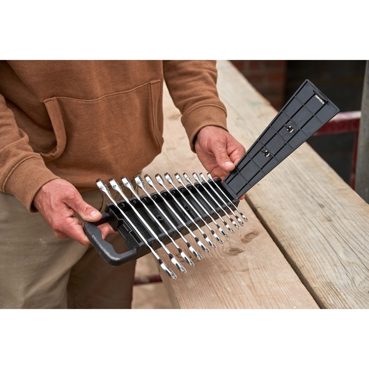 STANLEY STMT82843-0 combination wrench set, 12 pieces, in black plastic holder, shown held by person.
