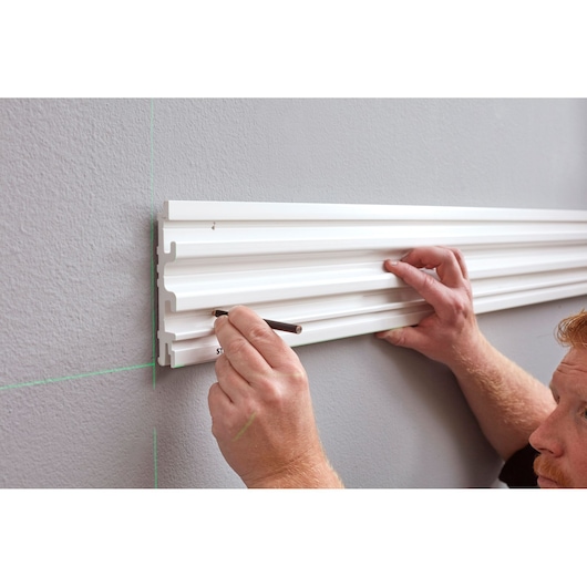 STANLEY STST82602-1 wall organizer rail, marked for installation, photography from side angle.